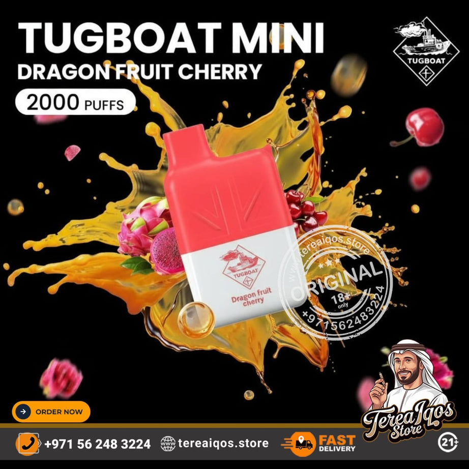 Tugboat Mini Dragon Fruit Cherry vape device with colorful splashes on a black background, featuring branding and contact information.